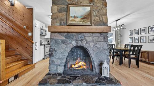 7312 Fintry Delta Road, Kelowna, BC - Indoor Photo Showing Other Room With Fireplace