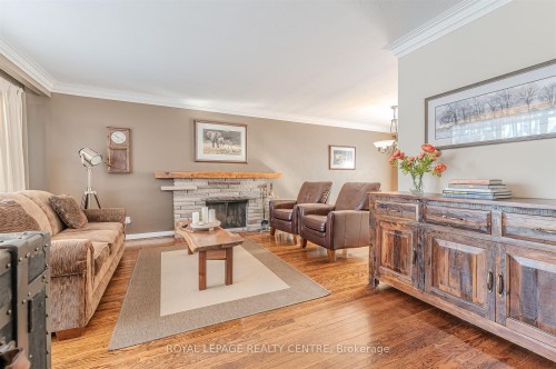 27 Hernshaw Crescent, Toronto, ON - Indoor Photo Showing Living Room With Fireplace