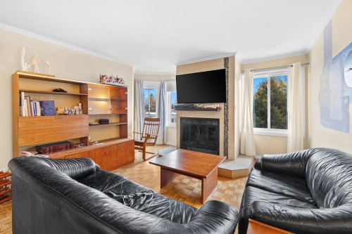 Living Room - 305-127 Boul. St-Elzear E., Laval (Vimont), QC - Indoor Photo Showing Living Room With Fireplace