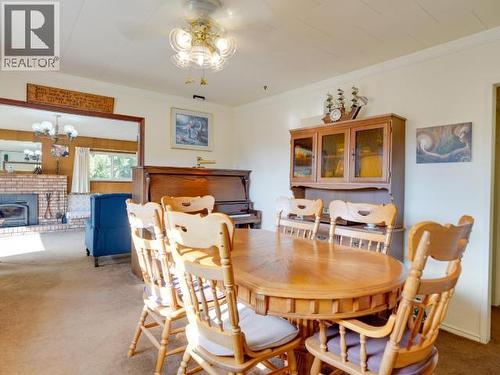 2468 Zilinsky Road, Powell River, BC - Indoor Photo Showing Dining Room With Fireplace