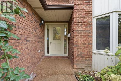 Front door entry with rubbercrete walkway - 668 Tomahawk Crescent, Ancaster, ON - Outdoor With Exterior