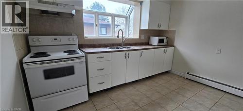 23 Rutherford Drive Unit# B, Kitchener, ON - Indoor Photo Showing Kitchen With Double Sink