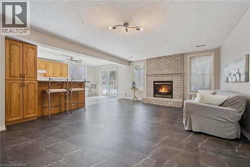 663 Heathcliffe Place, Waterloo, ON - Indoor Photo Showing Living Room With Fireplace