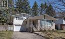 Tri-level home featuring asphalt driveway, a garage, and brick siding - 132 Forest Hill Drive, Kitchener, ON  - Outdoor 