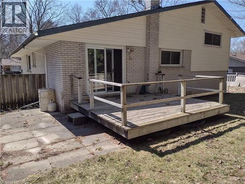 Back of house featuring brick siding, a chimney, and a wooden deck - 132 Forest Hill Drive, Kitchener, ON - Outdoor With Deck Patio Veranda With Exterior