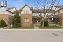 Traditional-style home featuring covered porch and brick siding - 100 Beddoe Drive Unit# 25, Hamilton, ON  - Outdoor With Facade 