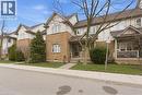 Traditional-style home with brick siding, a front lawn, and a porch - 100 Beddoe Drive Unit# 25, Hamilton, ON  - Outdoor With Facade 