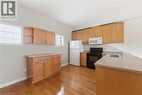 Kitchen featuring light brown cabinets - 100 Beddoe Drive Unit# 25, Hamilton, ON - Indoor Photo Showing Kitchen With Double Sink