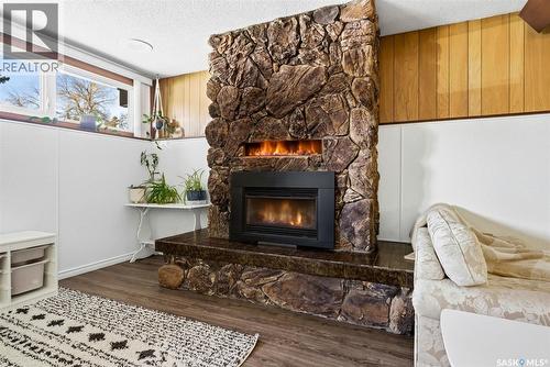 26 Mill Bay, Regina, SK - Indoor Photo Showing Living Room With Fireplace