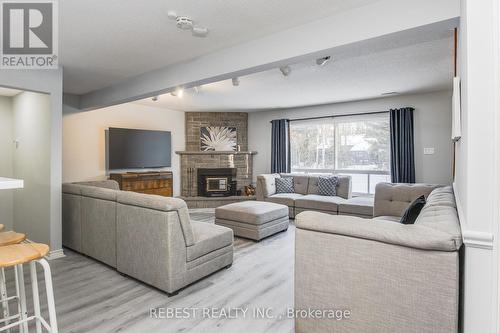 910 Concession Rd 17 W, Tiny, ON - Indoor Photo Showing Living Room With Fireplace