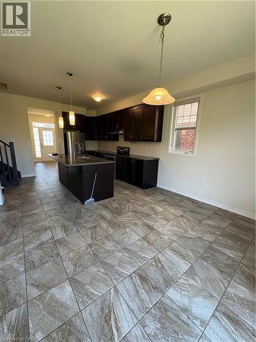 Kitchen featuring pendant lighting, refrigerator, electric range, and healthy amount of natural light - 50 Shoreacres Drive, Kitchener, ON - Indoor