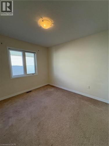 Empty room featuring baseboards and carpet - 50 Shoreacres Drive, Kitchener, ON - Indoor Photo Showing Other Room