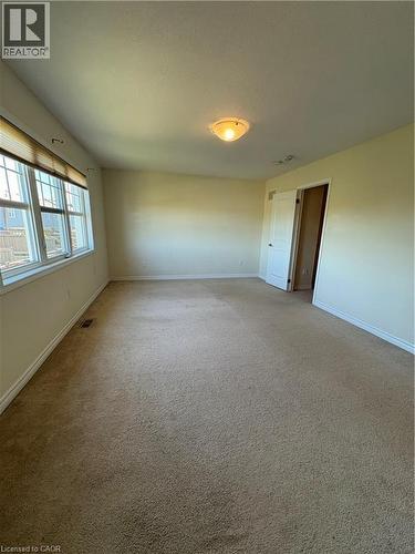 Carpeted empty room featuring baseboards - 50 Shoreacres Drive, Kitchener, ON - Indoor Photo Showing Other Room