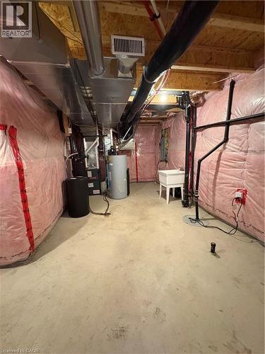 Unfinished basement with gas water heater, heating unit, and electric panel - 50 Shoreacres Drive, Kitchener, ON - Indoor Photo Showing Basement