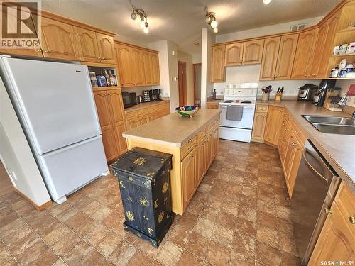 115 Carson Bay, Lampman, SK - Indoor Photo Showing Kitchen With Double Sink