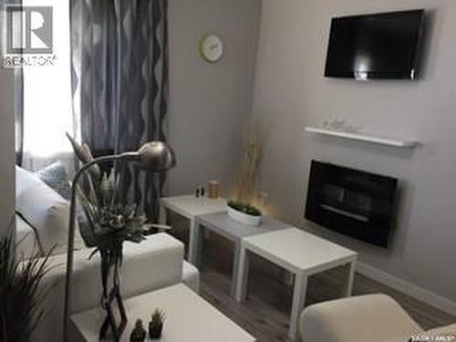 3-4 75 And 85 Atlantic Avenue, Kerrobert, SK - Indoor Photo Showing Living Room With Fireplace