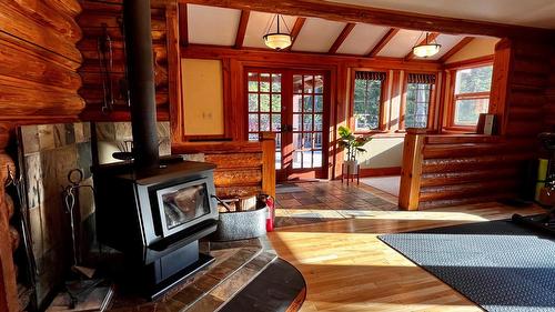 785 Beech Road, Nakusp, BC - Indoor Photo Showing Other Room With Fireplace