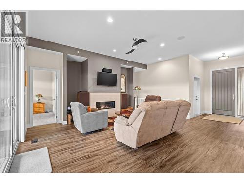 Living room - 2372 Oglow Drive, Armstrong, BC - Indoor Photo Showing Other Room With Fireplace