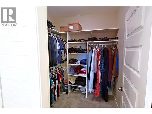 Walk in closet in primary bedroom - 2372 Oglow Drive, Armstrong, BC - Indoor With Storage