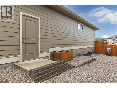 Man entrance to garage - 2372 Oglow Drive, Armstrong, BC - Outdoor With Exterior