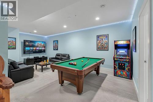 Virtual staging of recreation room in basement - 2372 Oglow Drive, Armstrong, BC - Indoor Photo Showing Other Room