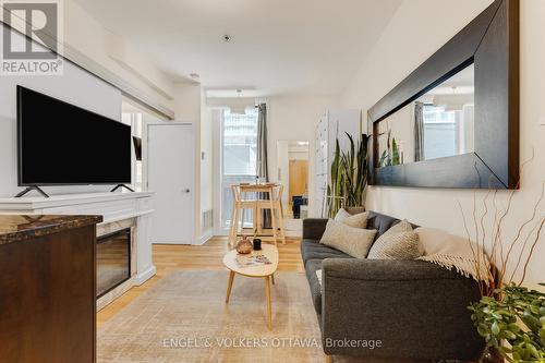 104 - 360 Cumberland Street, Ottawa, ON - Indoor Photo Showing Living Room With Fireplace