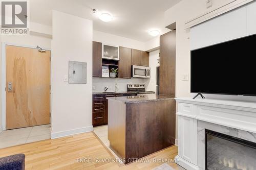 104 - 360 Cumberland Street, Ottawa, ON - Indoor Photo Showing Kitchen With Fireplace