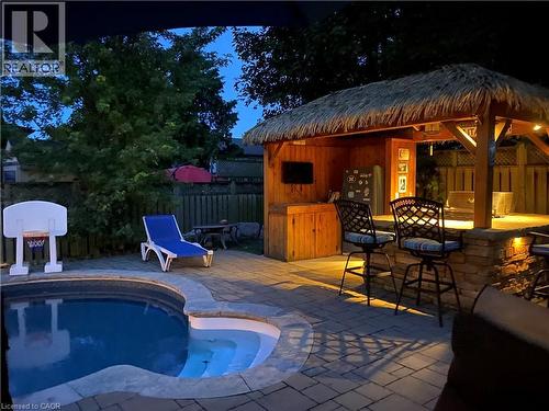 View of pool with a fenced backyard and patio surround - 3354 Bristol Drive, Burlington, ON - Outdoor With In Ground Pool With Deck Patio Veranda
