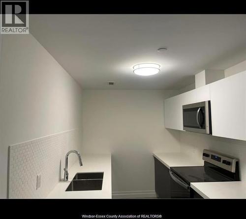 3320 Stella Unit# 412, Windsor, ON - Indoor Photo Showing Kitchen With Double Sink