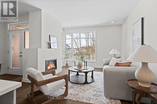 1003 Kitigan Grove, Ottawa, ON - Indoor Photo Showing Living Room With Fireplace