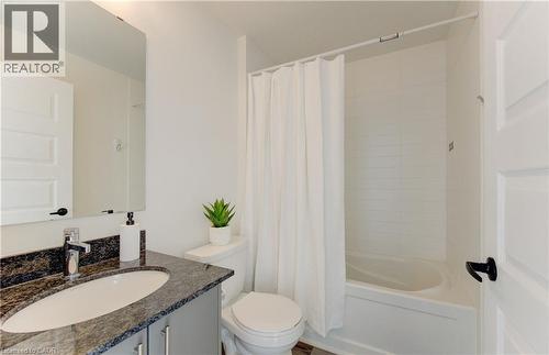 Full bathroom featuring vanity and shower / tub combo with curtain - 103 Roger Street Unit# 310, Waterloo, ON - Indoor Photo Showing Bathroom