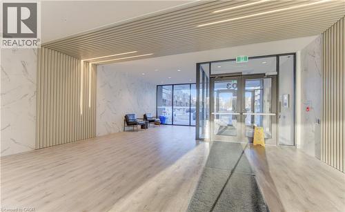 Common area featuring expansive windows - 103 Roger Street Unit# 310, Waterloo, ON - Indoor Photo Showing Other Room