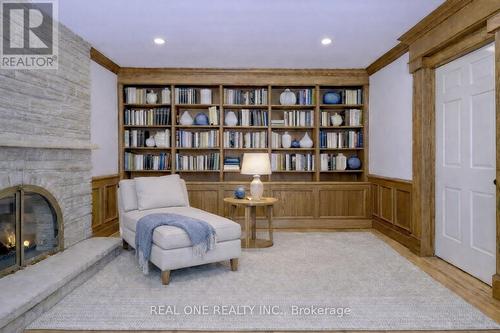 Virtually Staged Reading Nook - 1585 Crombie Road, Mississauga, ON - Indoor Photo Showing Other Room With Fireplace