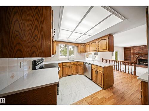 823 Richards Cr Nw, Edmonton, AB - Indoor Photo Showing Kitchen With Fireplace