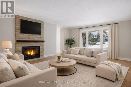 This photo is virtually staged - 1951 Garfield Avenue, Ottawa, ON - Indoor Photo Showing Living Room With Fireplace