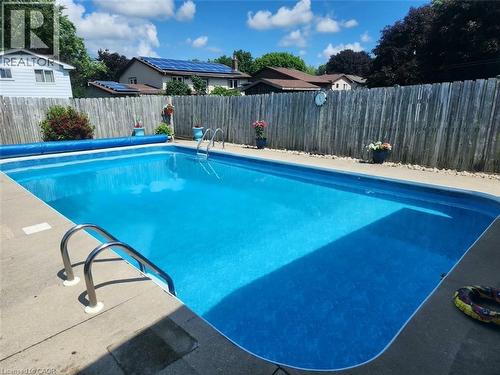 218 Arris Crescent, Mitchell, ON - Outdoor With In Ground Pool With Backyard