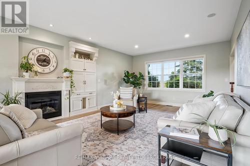 Cozy gas fireplace in bright living room - 2231 Seventh Street, St. Catharines (Rural Fourth), ON - Indoor Photo Showing Living Room With Fireplace