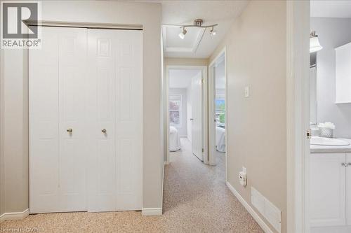Corridor with baseboards and light carpet - 66 Rodgers Road Unit# 2, Guelph, ON - Indoor