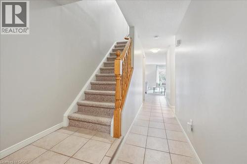 Stairs with tile patterned floors - 66 Rodgers Road Unit# 2, Guelph, ON - Indoor Photo Showing Other Room