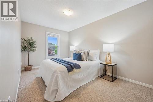 Bedroom with baseboards and carpet floors - 66 Rodgers Road Unit# 2, Guelph, ON - Indoor Photo Showing Bedroom