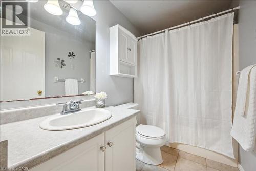 Full bath featuring vanity, tile patterned floors, and a shower with curtain - 66 Rodgers Road Unit# 2, Guelph, ON - Indoor Photo Showing Bathroom