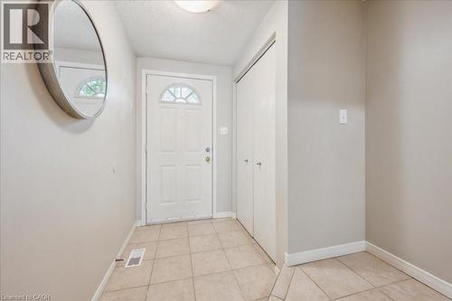 Entryway featuring a textured ceiling and light tile patterned flooring - 66 Rodgers Road Unit# 2, Guelph, ON - Indoor Photo Showing Other Room