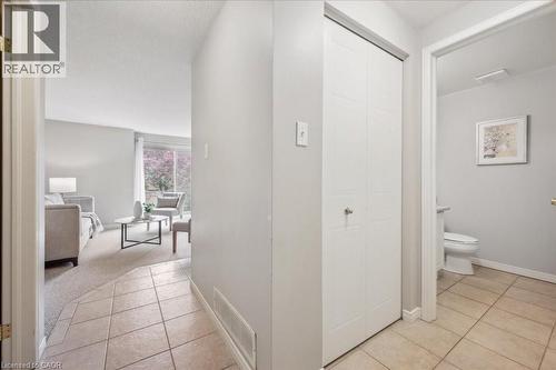 Hallway with light tile patterned floors and baseboards - 66 Rodgers Road Unit# 2, Guelph, ON - Indoor
