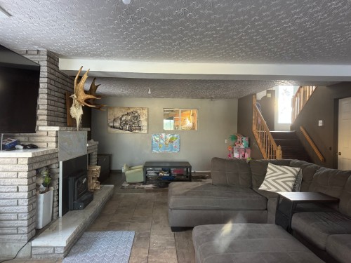 Salle familiale - 1214 Ch. Robert'S, Rouyn-Noranda, QC - Indoor Photo Showing Living Room With Fireplace