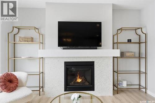 406 Chelsom Manor, Saskatoon, SK - Indoor Photo Showing Living Room With Fireplace