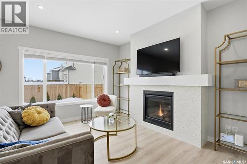 406 Chelsom Manor, Saskatoon, SK - Indoor Photo Showing Living Room With Fireplace