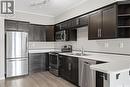 120 545 Hassard Close, Saskatoon, SK  - Indoor Photo Showing Kitchen With Double Sink 