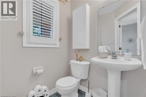 Half bath featuring toilet and baseboards - 42 Archer Way, Hamilton, ON - Indoor Photo Showing Bathroom