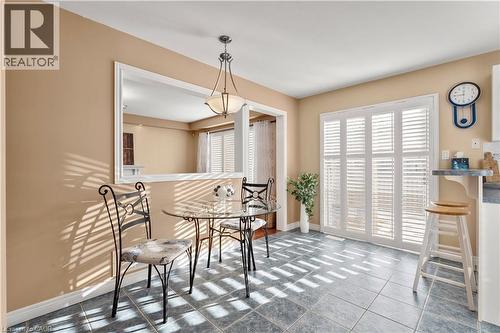 Tiled dining room with baseboards - 42 Archer Way, Hamilton, ON - Indoor