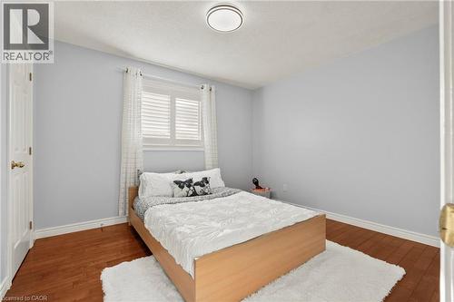 Bedroom featuring harwood flooring and a textured ceiling - 42 Archer Way, Hamilton, ON - Indoor Photo Showing Bedroom